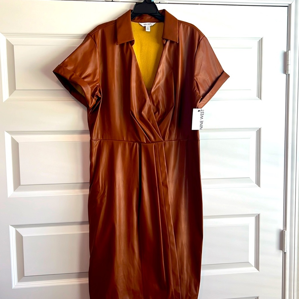 Short sleeve leather dress. New never worn. Light weight